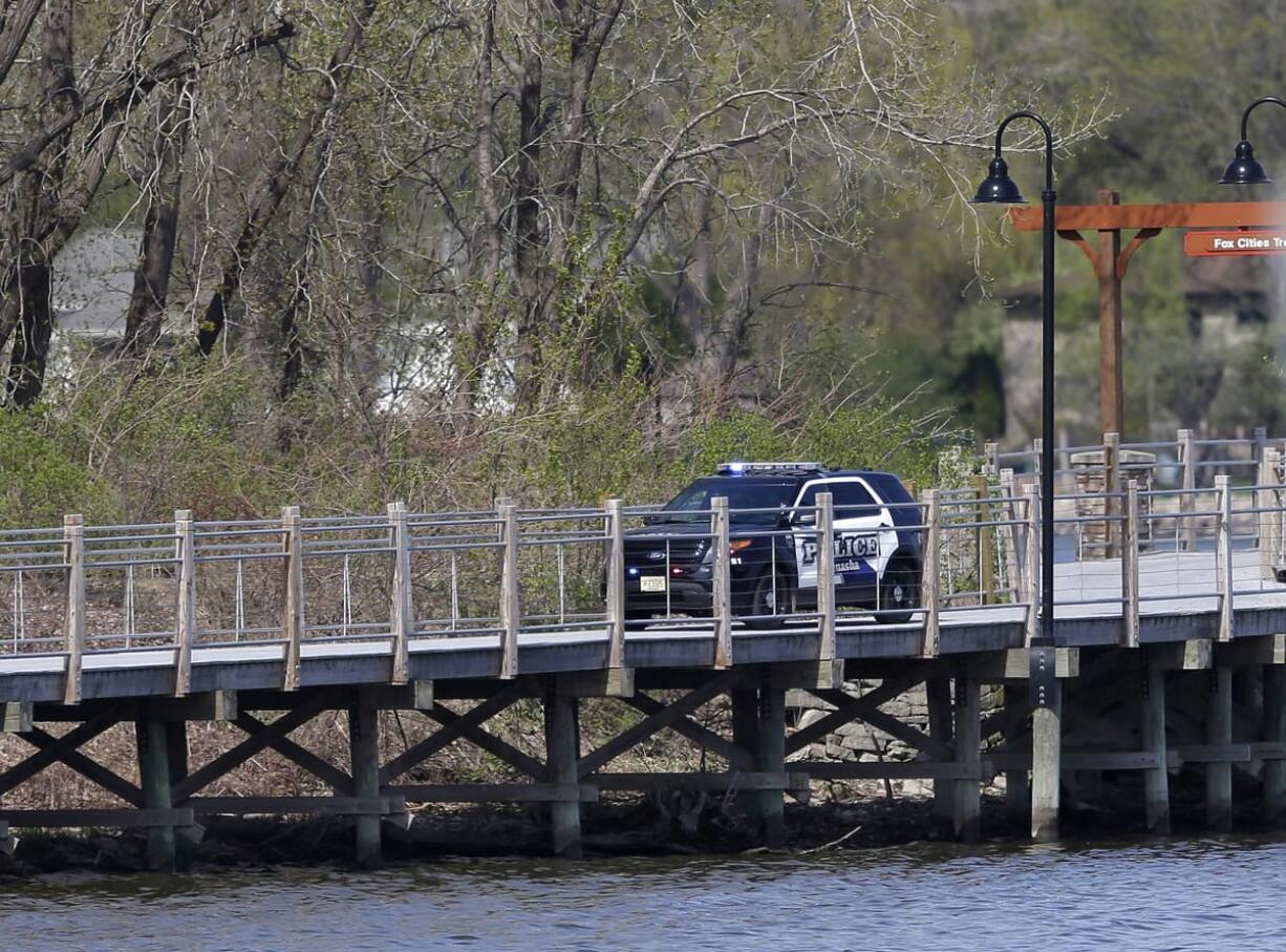 Menasha police continue to investigate a shooting Monday in Menasha, Wis., that resulted in four fatalities and one person injured on the Fox Cities Trestle Trail bridge in Menasha, Wis. Police  say the gunman opened fire on the bridge Sunday night in a random shooting.