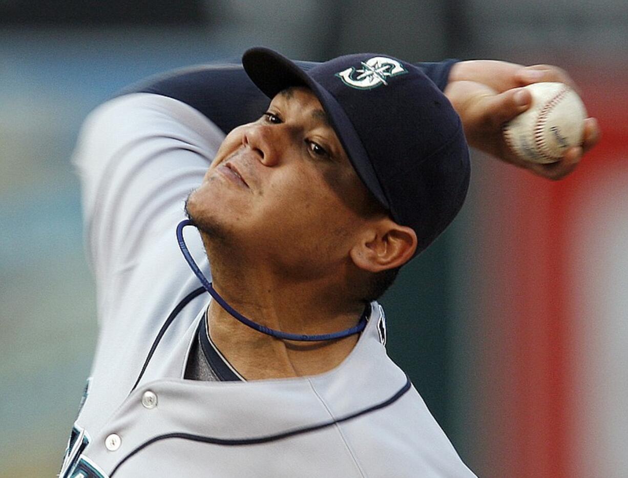 FILE - This May 18, 2010, file photo shows Seattle Mariners' Felix Hernandez in action against the Oakland Athletics during the first inning of a baseball game, in Oakland, Calif. Hernandez has been chosen the AL Cy Young Award winner, Thursday, Nov.