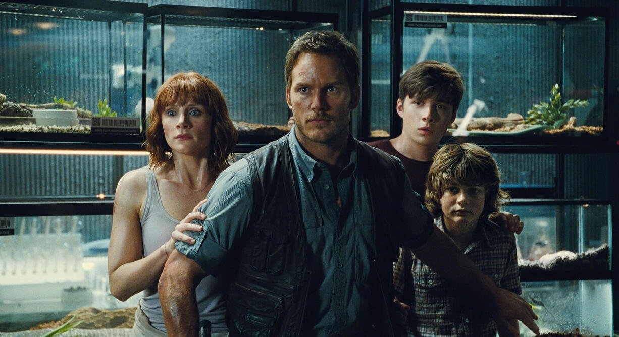 Bryce Dallas Howard, from left, Chris Pratt, Nick Robinson and Ty Simpkins band together in &quot;Jurassic World,&quot; directed by Colin Trevorrow.