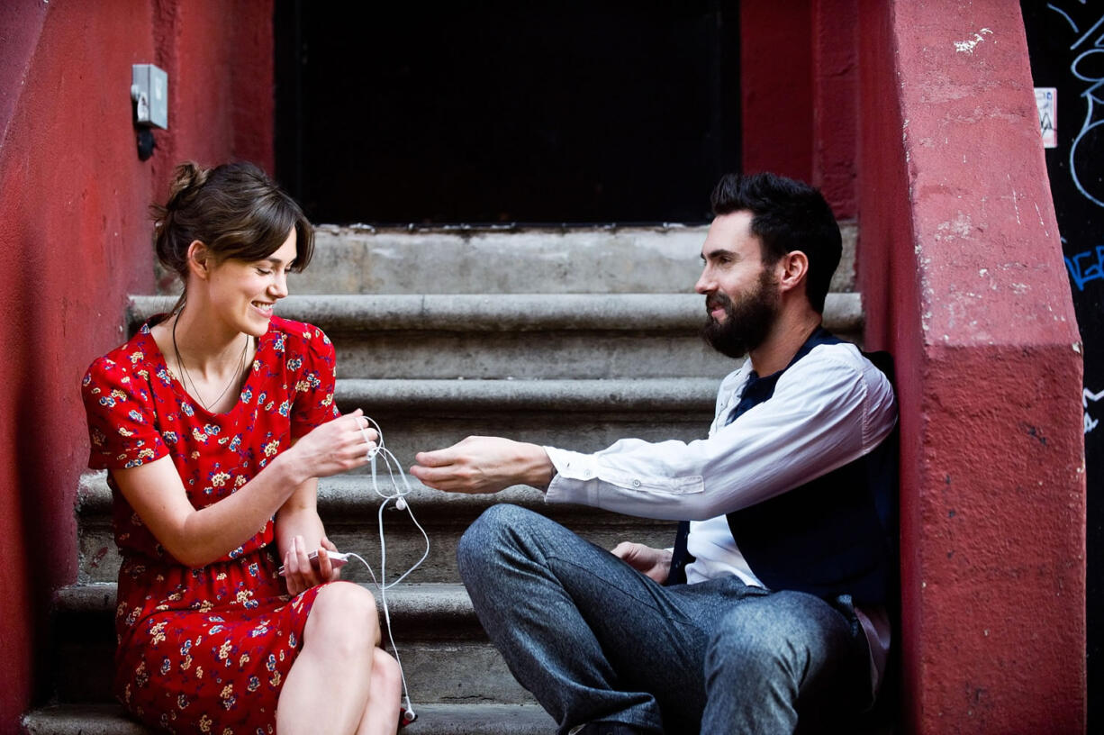 Keira Knightley, left, and Adam Levine in a scene from &quot;Begin Again.&quot;