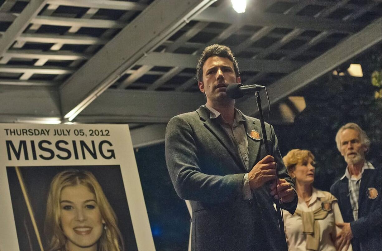 Rosamund Pike, left, and Ben Affleck, center, star in &quot;Gone Girl,&quot; which becomes a story about public relations in private affairs -- how narratives are shaped, both out in the media and at home in a marriage.