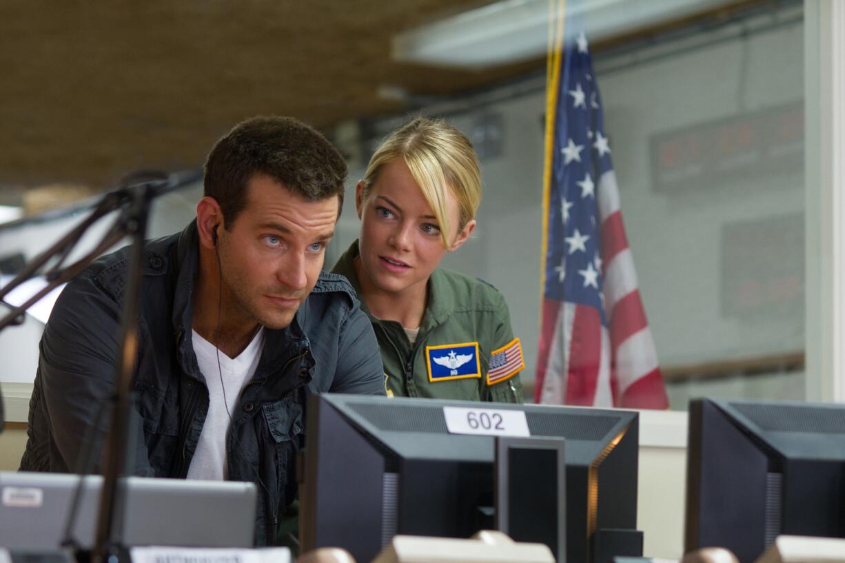 Sony Pictures Entertainment files
Bradley Cooper, left, and Emma Stone star in &quot;Aloha.&quot; Director Cameron Crowe has apologized for casting Stone as a part-Asian character in the film.