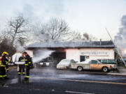 Emergency crews respond to a fire Sunday morning at Walt's Quality Auto Detailing on Main Street in Vancouver.