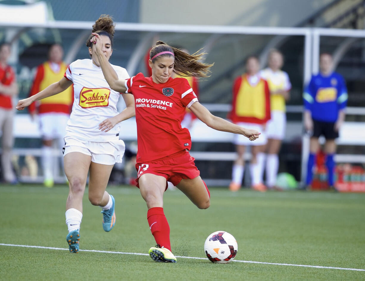 Portland Thorns FC's Alex Morgan, right.