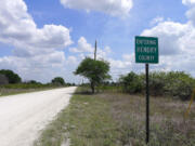 A marker identifying the Hendry County line in Florida.