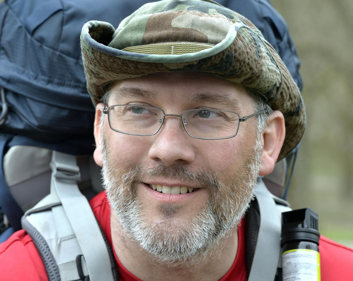 Curtis Penix smiles as he arrives at the site of the original Fort Boonesborough, Ky., Thursday, March 26, 2015. Penix walked the 240 mile Boone Trace following the trail his 5th great grandfather Joshua Penix walked with Daniel Boone in 1775. (AP Photo/Timothy D.