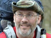 Curtis Penix smiles as he arrives at the site of the original Fort Boonesborough, Ky., Thursday, March 26, 2015. Penix walked the 240 mile Boone Trace following the trail his 5th great grandfather Joshua Penix walked with Daniel Boone in 1775. (AP Photo/Timothy D.