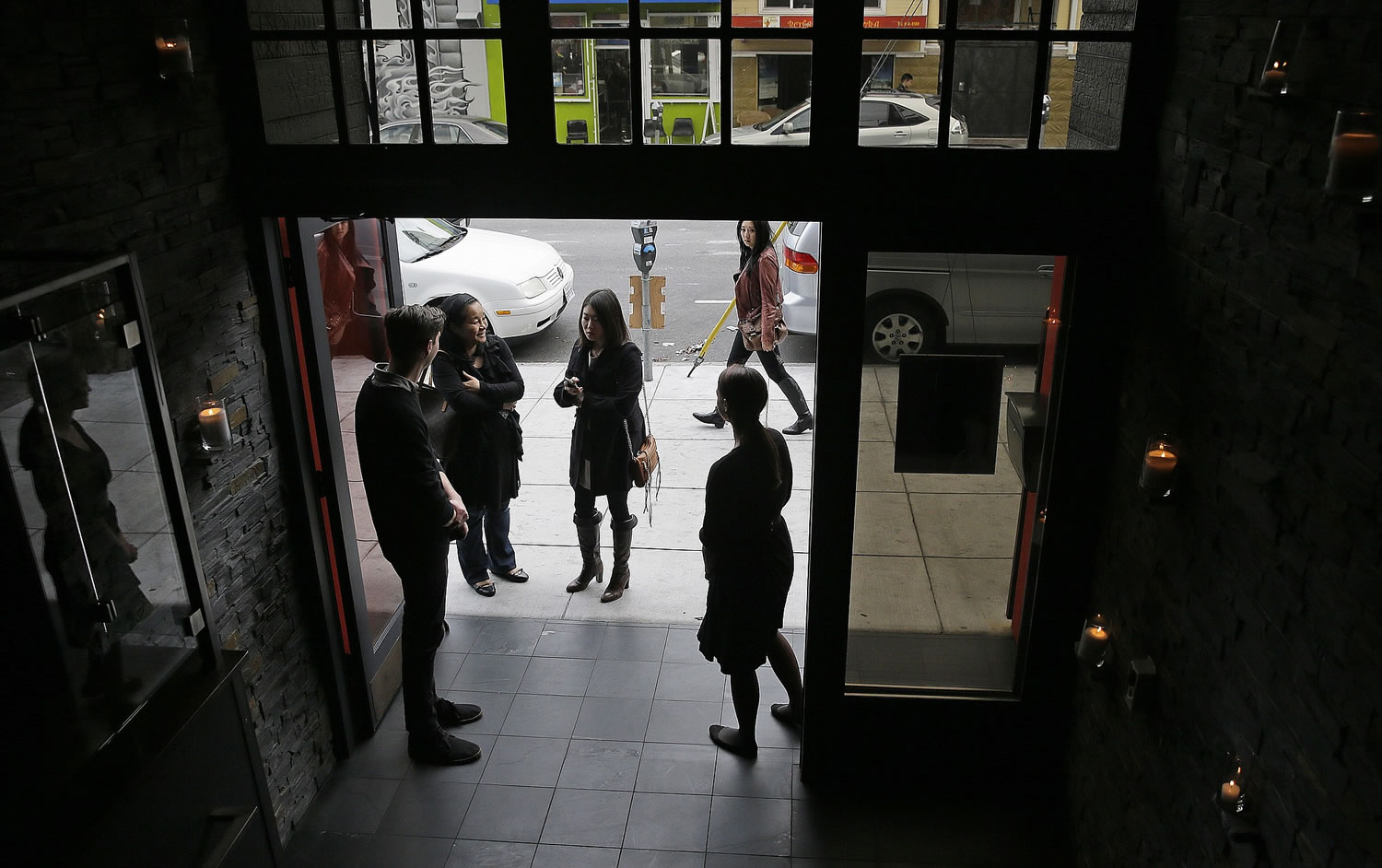 Ticketed diners are greeted upon arrival for the first seating at the Lazy Bear restaurant in San Francisco.