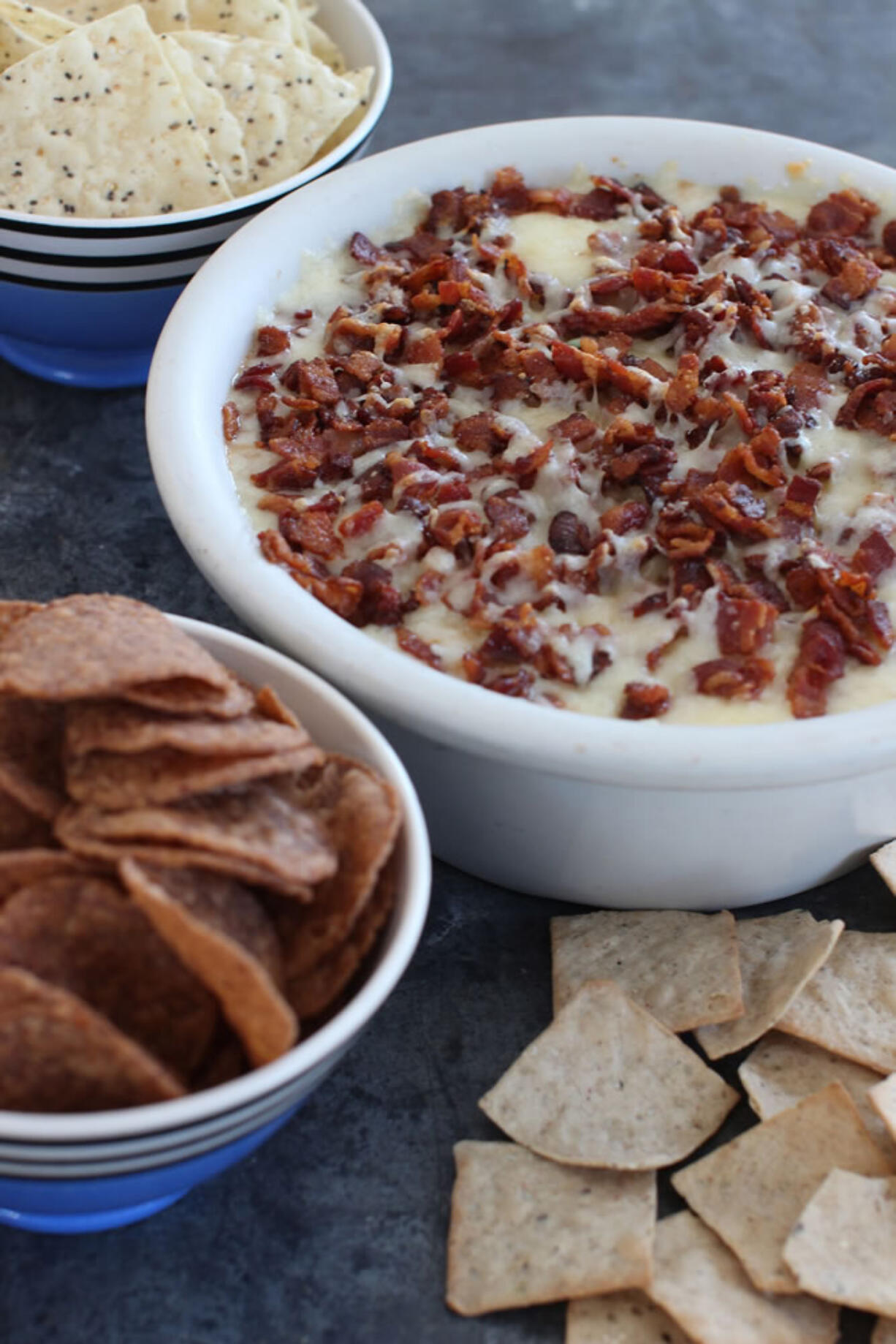 The New England super seven dip made with barbecued pulled pork topped with skillet sauteed apples and butter