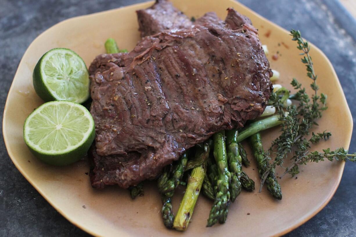 Vietnamese style skirt steak with aspapagus and scalliions