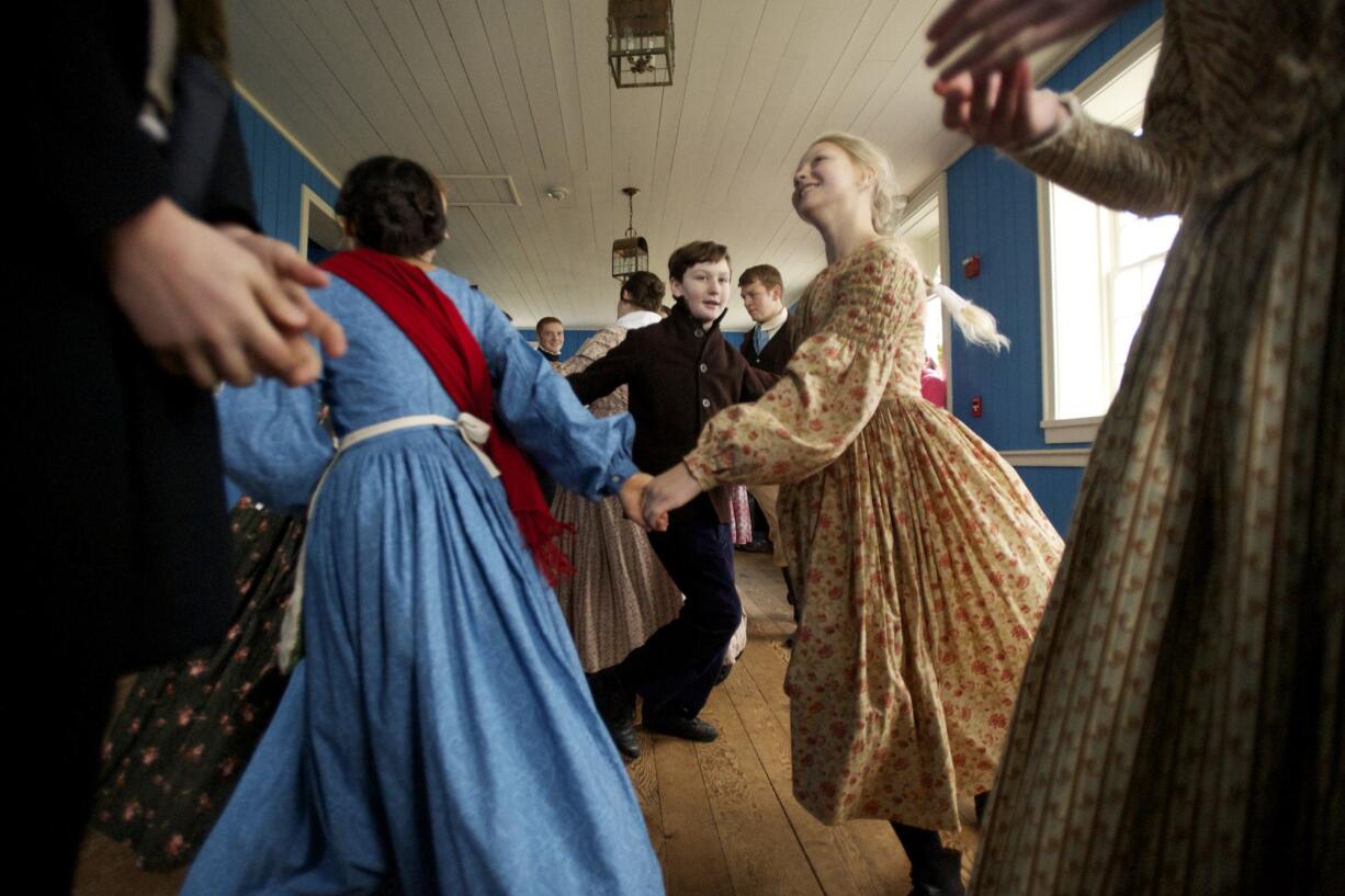 Children dance in the Counting House at Fort Vancouver during the annual Christmas at the Fort event in 2013.