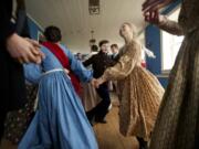 Children dance in the Counting House at Fort Vancouver during the annual Christmas at the Fort event in 2013.