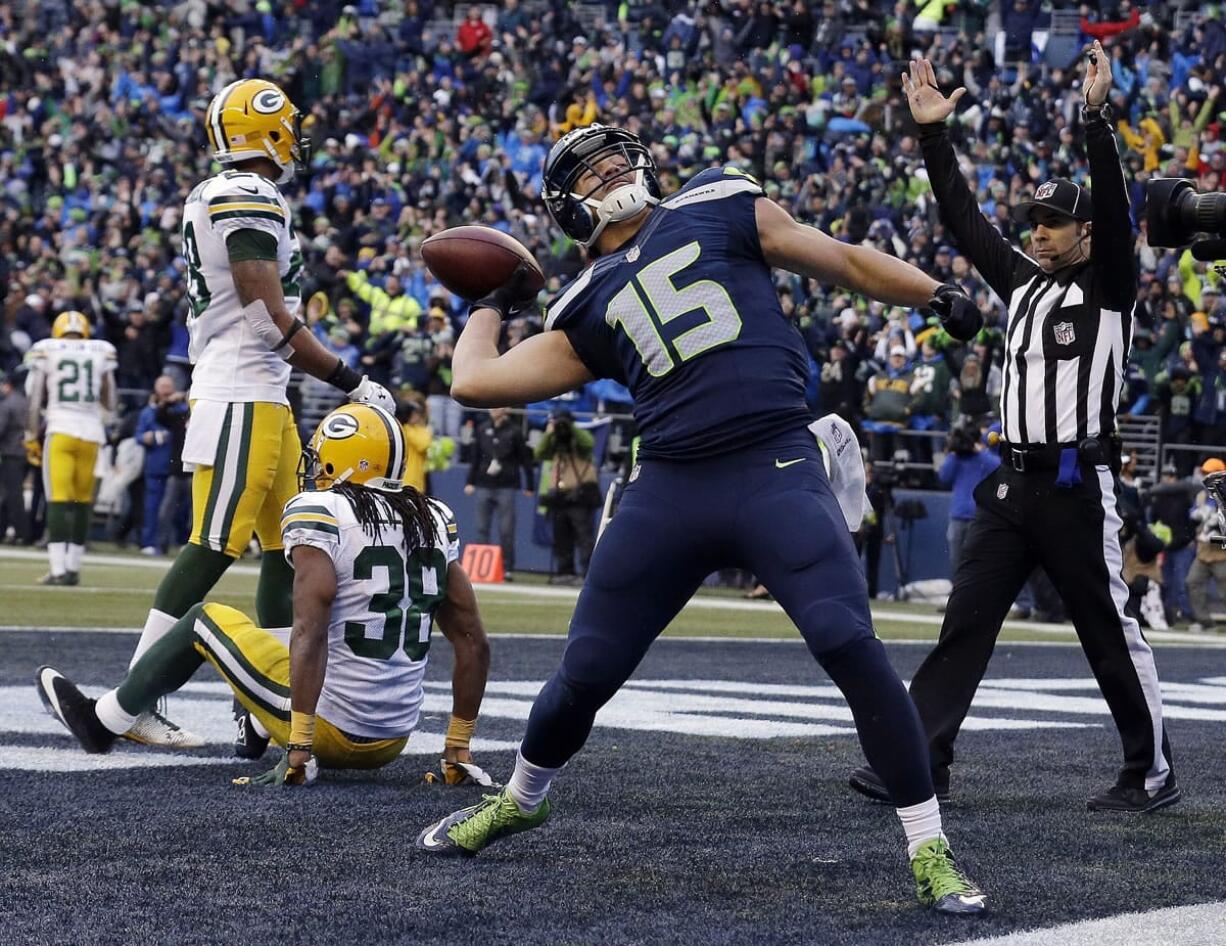 Seattle Seahawks' Jermaine Kearse celebrates after catching the game-winning touchdown during overtime of the NFC Championship game against the Green Bay Packers on Sunday, Jan. 18, 2015, in Seattle. The Seahawks won 28-22 to advance to Super Bowl XLIX.