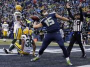 Seattle Seahawks' Jermaine Kearse celebrates after catching the game-winning touchdown during overtime of the NFC Championship game against the Green Bay Packers on Sunday, Jan. 18, 2015, in Seattle. The Seahawks won 28-22 to advance to Super Bowl XLIX.