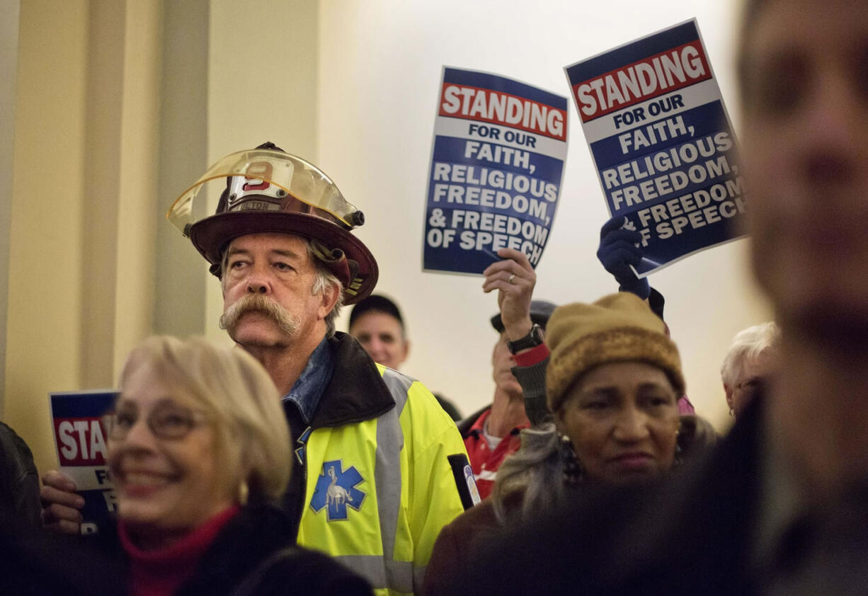 Michael O'Hara, a retired Fulton County firefighter and current Coweta County paramedic attends a Jan. 13 rally to support former Atlanta fire chief Kelvin Cochran following his termination in Atlanta. Even as the U.S. Supreme Court gets ready to decide whether gay couples can marry, lawmakers in the South and West are doubling down on the culture wars, backing longshot legislation targeting gay rights. In Georgia, the debate flared this month when Atlanta Mayor Kasim Reed fired the city?s fire chief after learning the chief self-published a book describing homosexuality as a perversion.