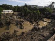 A destroyed, flooded zoo area is seen Monday in Tbilisi, Georgia.