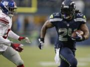 Seattle Seahawks running back Marshawn Lynch runs against the New York Giants in the second half Sunday, Nov. 9, 2014, in Seattle.