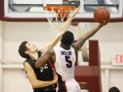 Loyola Marymount's Marin Mornar, left, fouls Gonzaga's Gary Bell Jr. during the second half Saturday, Jan. 17, 2015, in Los Angeles. Gonzaga won 72-55.