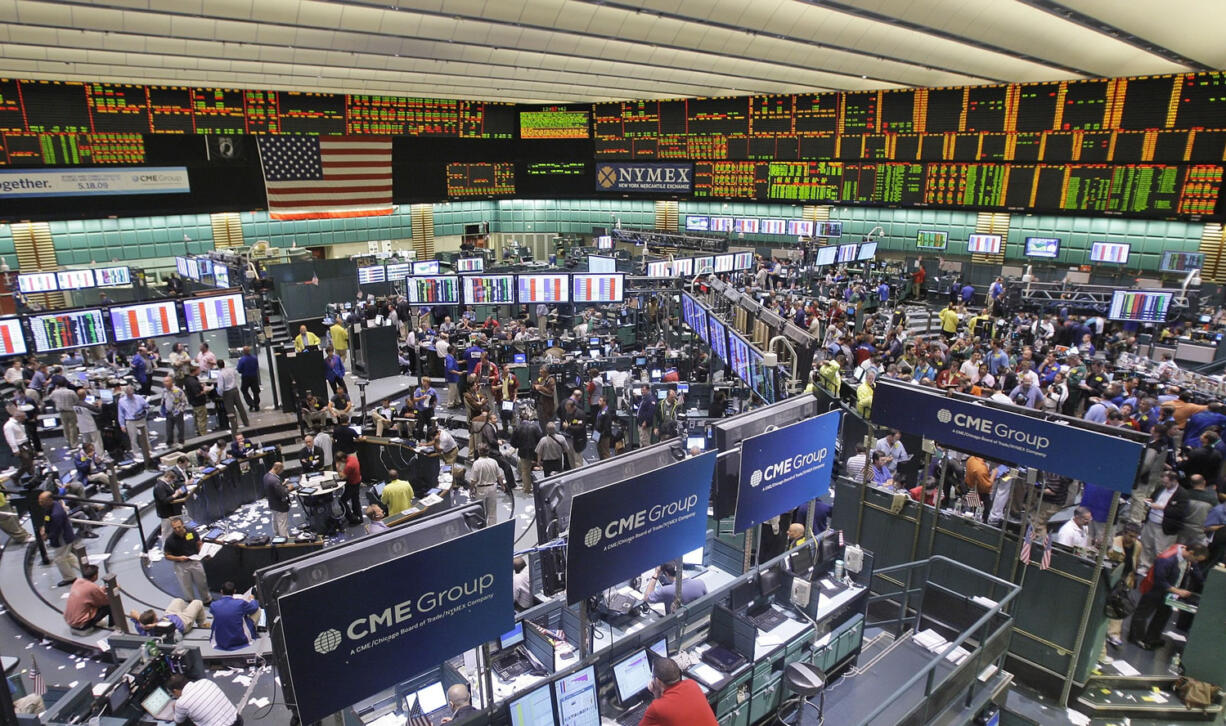 Associated Press files
Traders work on the floor of the New York Mercantile Exchange on July 13, 2009, in New York.