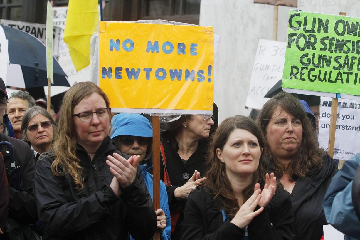 Gun control supporters join together for an Oregon Alliance to Prevent Gun Violence Day of Action rally in April 2013 at the Capitol steps in Salem, Ore.