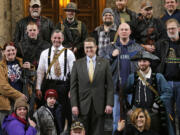 Washington Rep. Matt Shea, R-Spokane Valley, center, poses for a group photo with gun owners on  Jan.