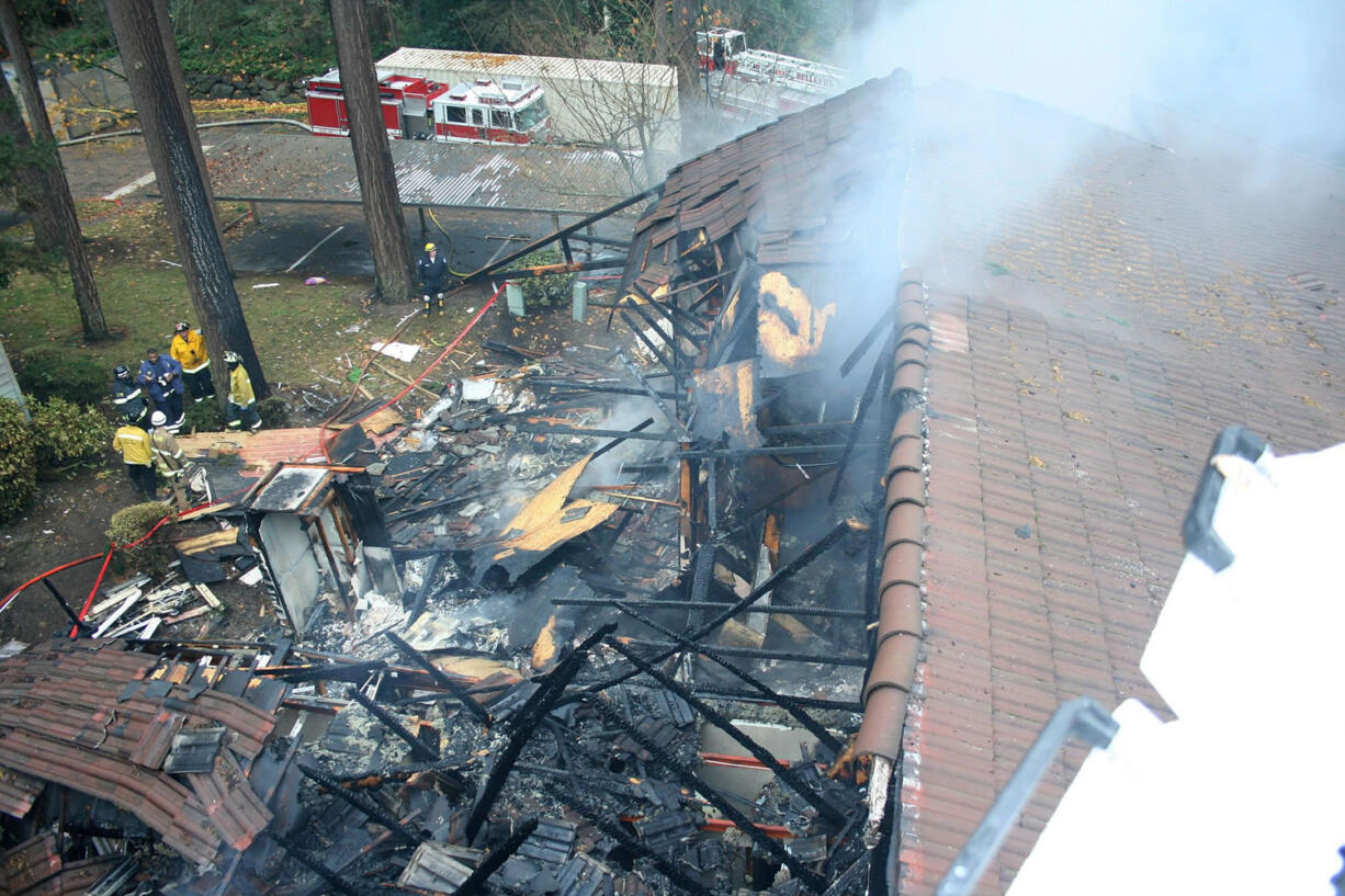 In this 2013 photo provided by the Bellevue Fire Department, the smoldering remains of a 10-unit building at the Hampton Greens Apartments are shown after an explosion from a hash-oil extraction operation in Bellevue, Wash. Federal prosecutors are seeking a 10-year, maximum sentence David Richard Schultz II, the man who joined two Microsoft workers in running the hash-oil operation. Schultz II is being sentenced Monday, June 8, 2015, in U.S. District Court. Prosecutors say the sentence send a message to others who might think Washington?s legalization of marijuana in 2012 gives them license to engage in dangerous home production of potent pot extracts.