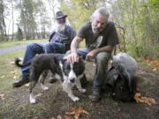 Andy Cripe/Corvallis Gazette-Times
Richard &quot;Stretch&quot; McCain, left, and Bob Brokaw hang out with Bob's dog, Lucas, near the Corvallis, Ore., skate park.