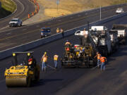 Workers do paving work in 2006 on Interstate 5 at Milepost 7, just south of the 134th Street offramp.