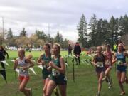 Camas senior Alissa Pudlitzke (78) and freshman Emma Jenkins (80) run in the Nike Cross Nationals on Saturday at Glendoveer Golf Course in Portland.