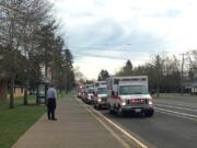 Ambulances line up outside of McLoughlin Middle School in Vancouver late Wednesday morning after a number of students fell ill after apparently ingesting chilli powder.