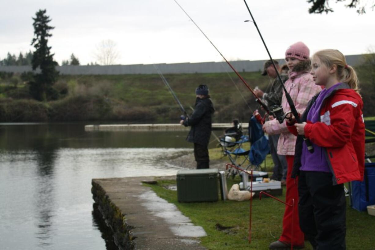 Andrea Tumlinson of Felida fished with her family at Klineline Pond Wednesday, a day before fish and wildlife representatives closed it for the weekend's Klineline Kids Fishing event.