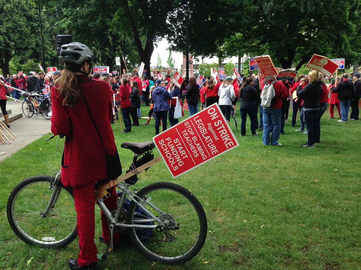 Teachers stage a rally at Esther Short Park today to call attention to their demands for more education funding.