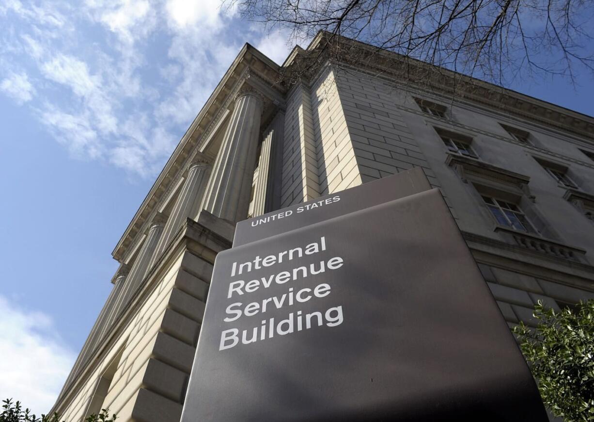 FILE - In this photo March 22, 2013 file photo, the exterior of the Internal Revenue Service (IRS) building in Washington. The IRS provided poor customer service during this year's tax filing season as taxpayers struggled with a rise in identity theft and complications related to President Barack Obama?s health law, a government watchdog said Wednesday. A new report by the National Taxpayer Advocate says the IRS has been hampered by budget cuts.