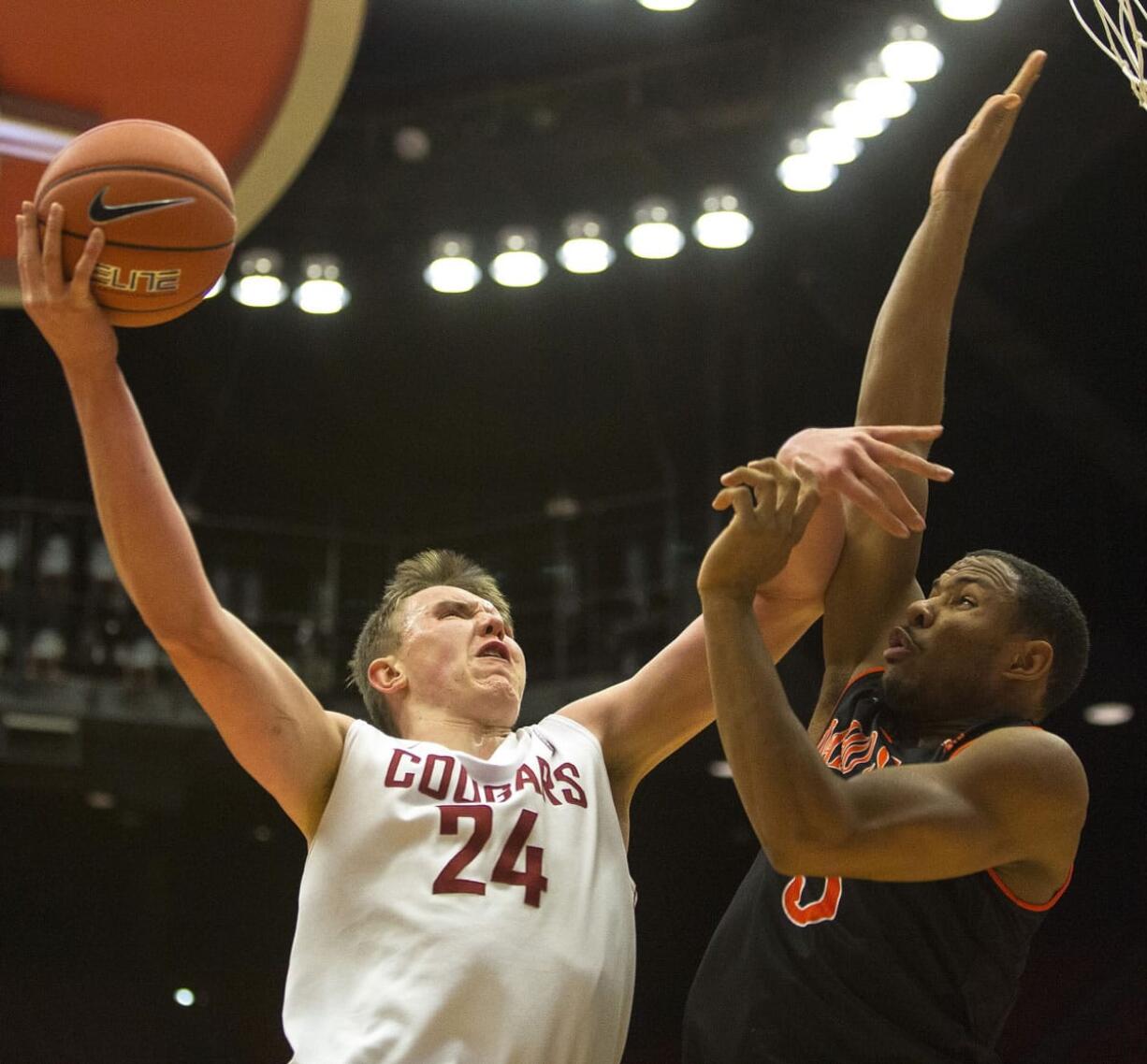 Washington State forward Josh Hawkinson (24) shoots over Idaho State forward Jeffrey Solarin (5) during the first half Friday, Nov. 21, 2014, in Pullman.