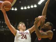 Washington State forward Josh Hawkinson (24) shoots over Idaho State forward Jeffrey Solarin (5) during the first half Friday, Nov. 21, 2014, in Pullman.