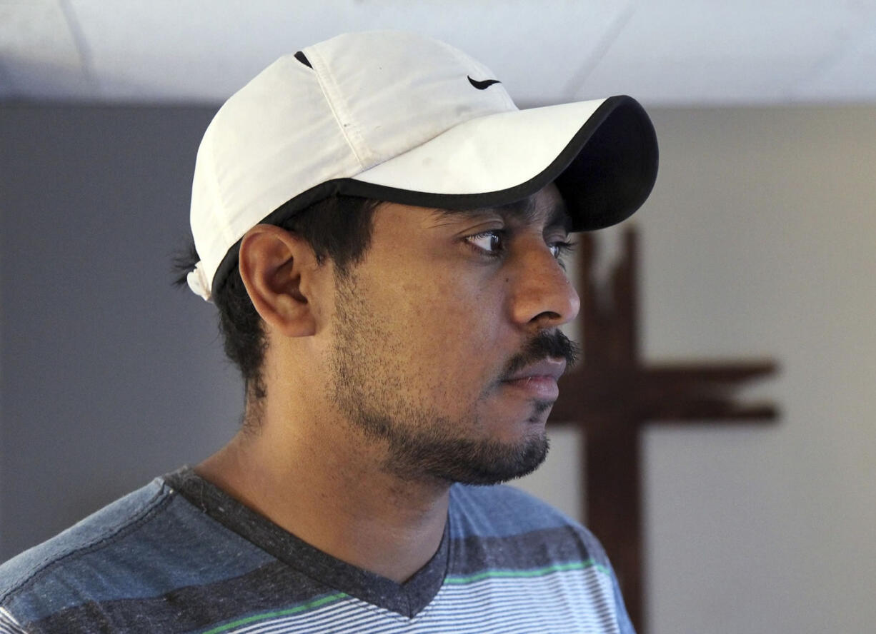 Associated Press files
Francisco Aguirre, a community activist who first came to the U.S. from El Salvador two decades ago, is seen Sept. 24 in the Portland church where he had taken refuge to avoid deportation. Aguirre was arrested on Thursday on federal charges of illegal re-entry.