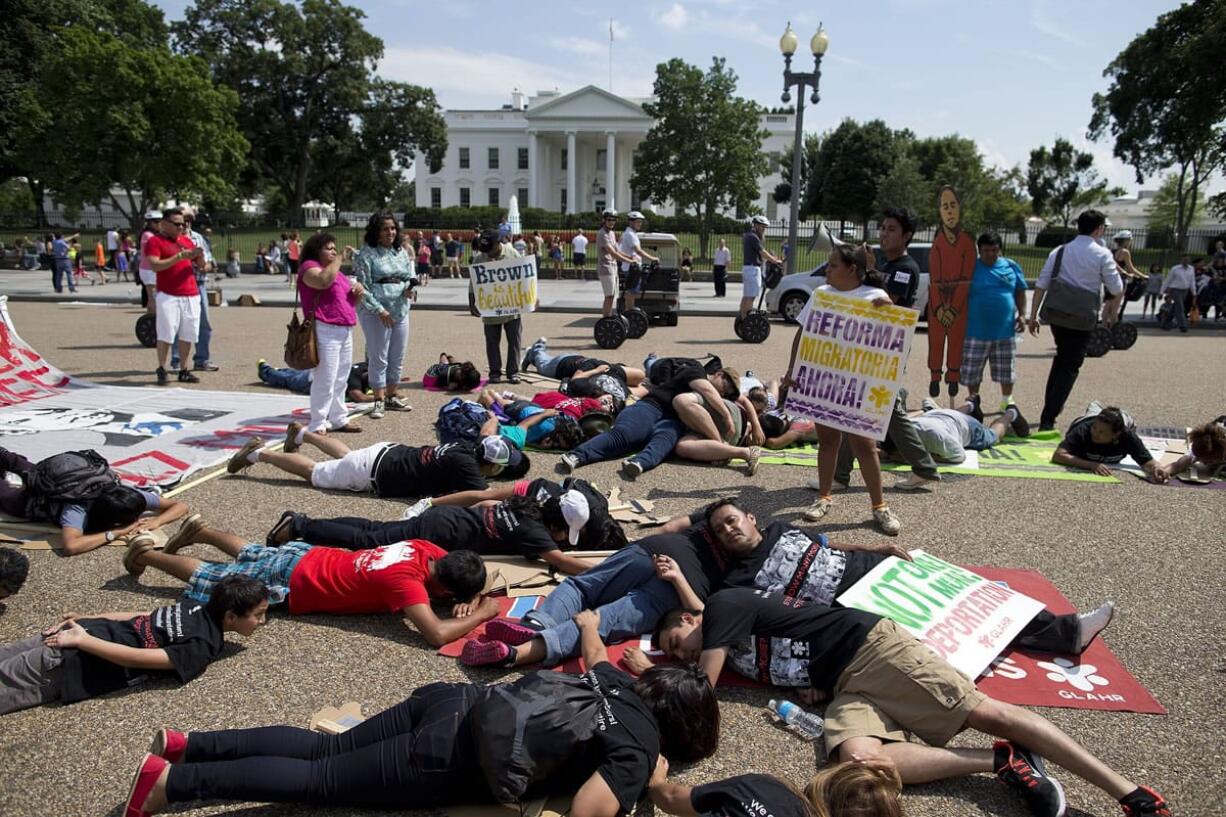 Demonstrators lay July 24, 2013 in front of the White House in Washington to represent deported family members during a rally for immigration reform. The sudden rise in the number of families and unaccompanied minors from Central America crossing the border in two United States has refocused attention on immigration, but hardly under the terms that President Barack Obama and immigrant advocates had once envisioned.