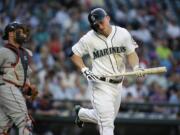 Seattle Mariners' Kyle Seager spins around after striking out to end the third inning against the Cleveland Indians on Thursday, May 28, 2015, in Seattle.