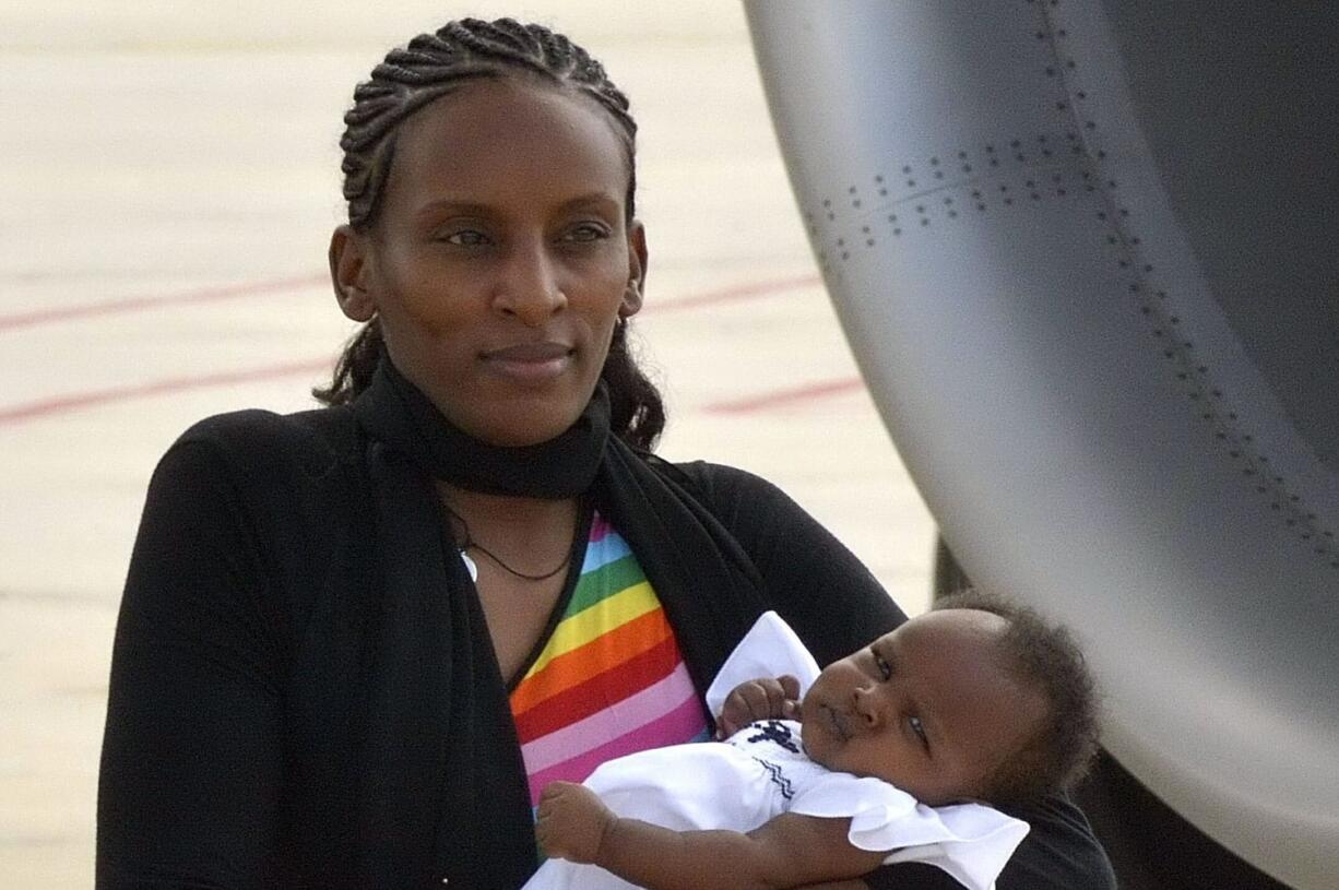 Meriam Ibrahim holds her baby girl, Maya, after landing from Khartoum, at Ciampinou2019s military airport, on the outskirts of Rome on Thursday.