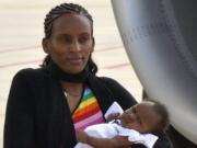 Meriam Ibrahim holds her baby girl, Maya, after landing from Khartoum, at Ciampinou2019s military airport, on the outskirts of Rome on Thursday.