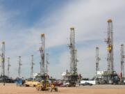 Associated Press files
A number of oil-drilling rigs are idled in the Helmerich