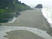 Associated Press files
Fishing boats float July 23, 2002, in the mouth of the Klamath River as it empties into the Pacific Ocean near Klamath, Calif. Deadly salmon parasites are thriving in the river, infecting nearly all the juvenile chinook salmon waiting to migrate to the ocean.