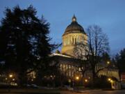 The Legislative building at the Washington state Capitol is shown at dusk Jan.