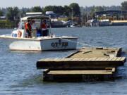 In July 2005, old docks are floated away from Marine Park after they were replaced.