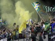 Portland Timbers fans celebrate after a goal during the second half of an MLS soccer game against the Houston Dynamo.