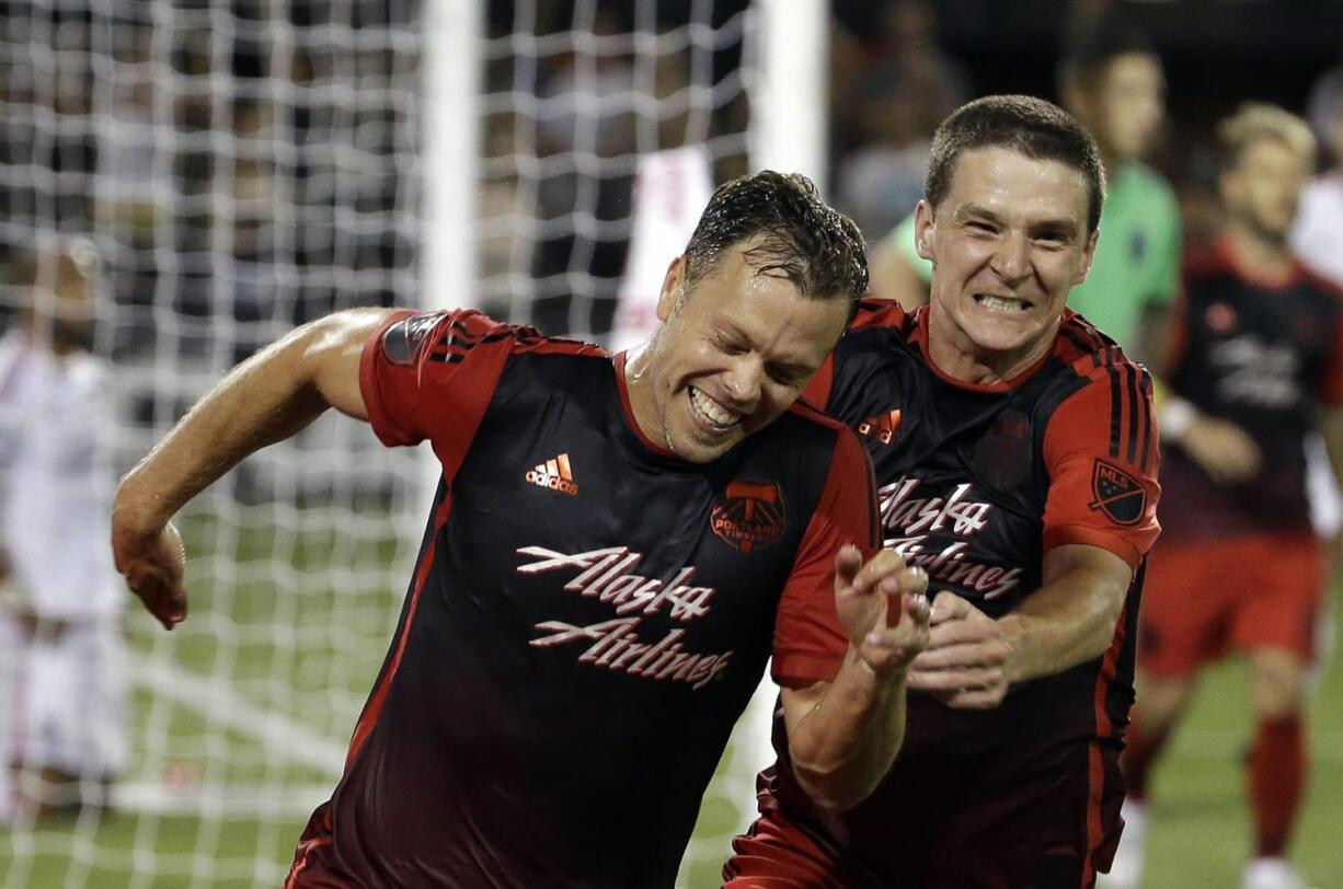 Portland Timbers defender Jack Jewsbury, left, celebrates his goal during stoppage time with teammate Will Johnson against the San Jose Earthquakes in Portland on Sunday, July 5, 2015. The Timbers won 1-0.