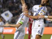 Los Angeles forward Robbie Keane, left, celebrates after scoring, with midfielder Baggio Husidic during the second half against Chicago on March 6.