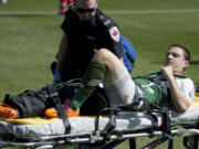 Portland Timbers midfielder Will Johnson is carted off the field on a stretcher after getting injured in the first half  against Toronto FC on Sept. 27, 2014.