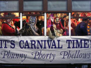 Associated Press files
Members of the Phunny Phorty Phellows celebrate aboard a streetcar on Jan. 6 in New Orleans. King's Day is a tradition marking the 12th night after Christmas and the official start of the Mardi season.