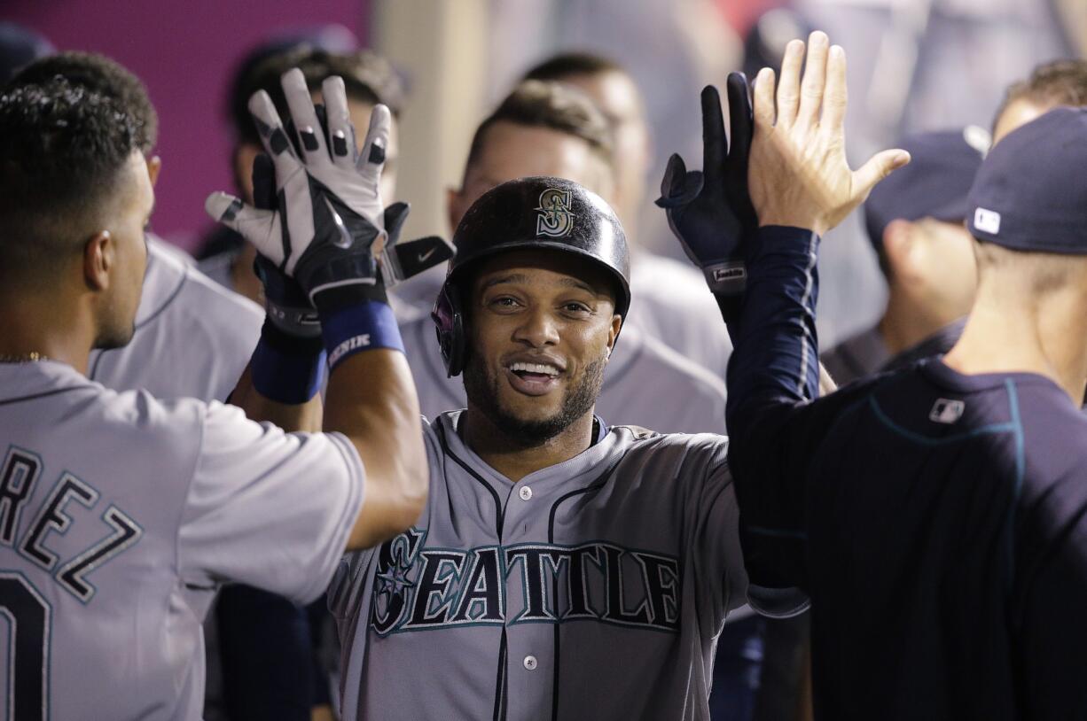 Robinson Cano celebrates his home run with teammates.